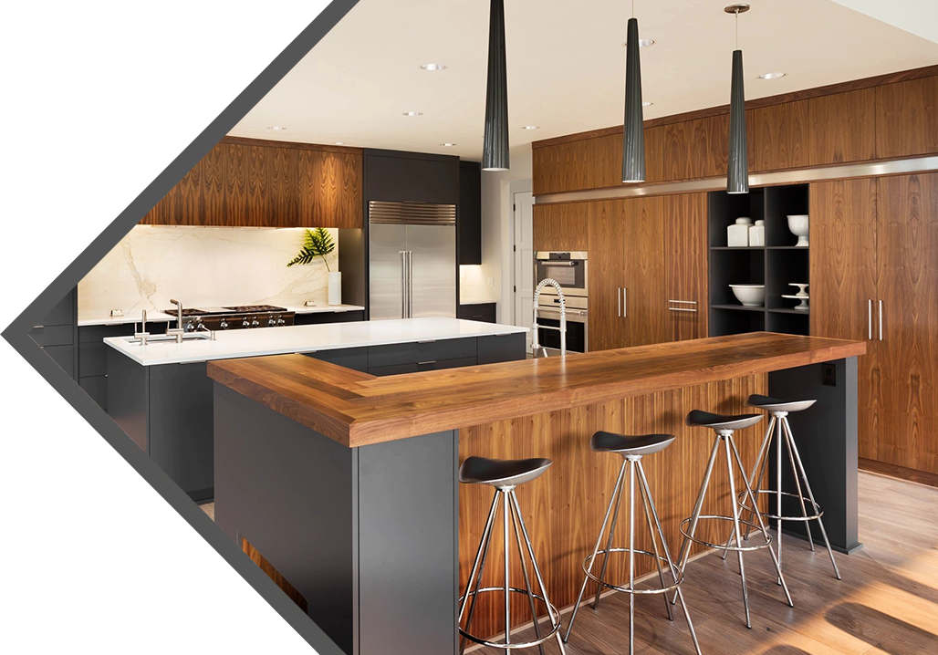 A kitchen with wooden counter tops and black stools.