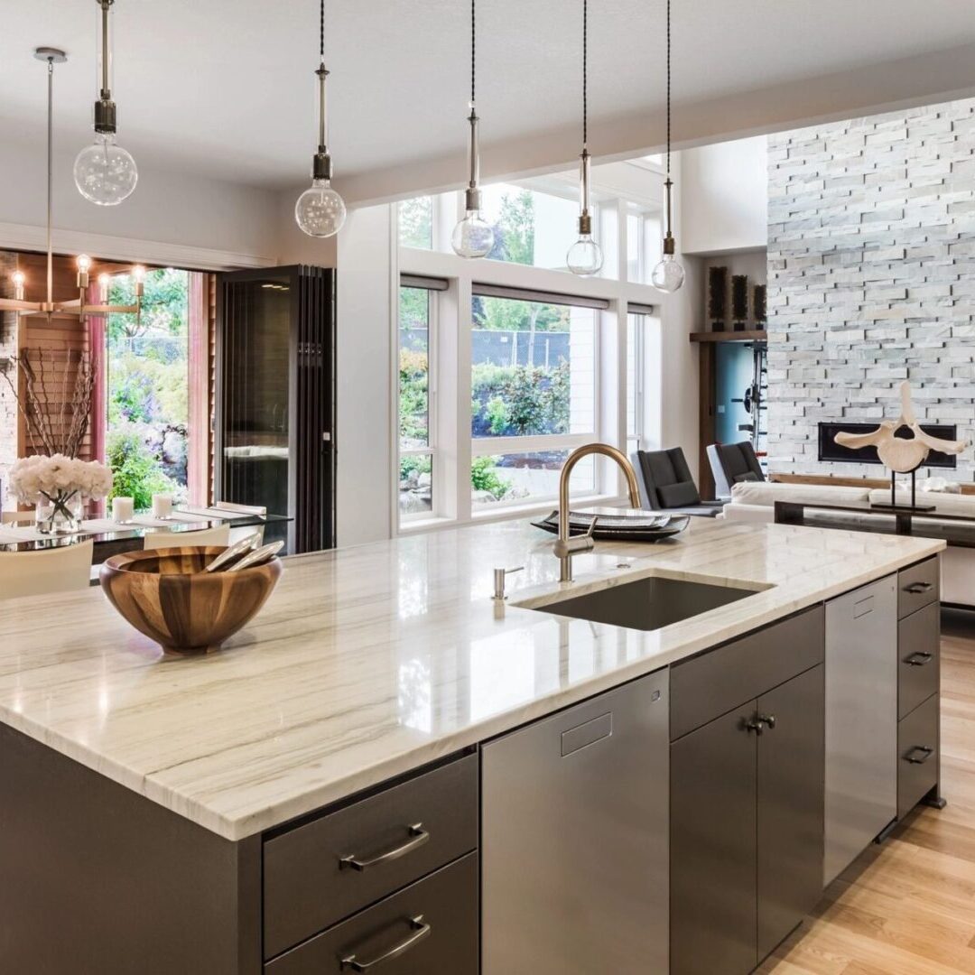 A kitchen with a large island and lots of counter space.