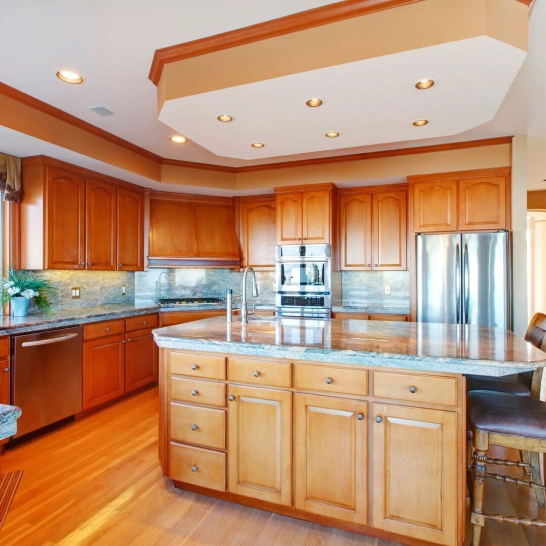 A kitchen with wooden cabinets and stainless steel appliances.